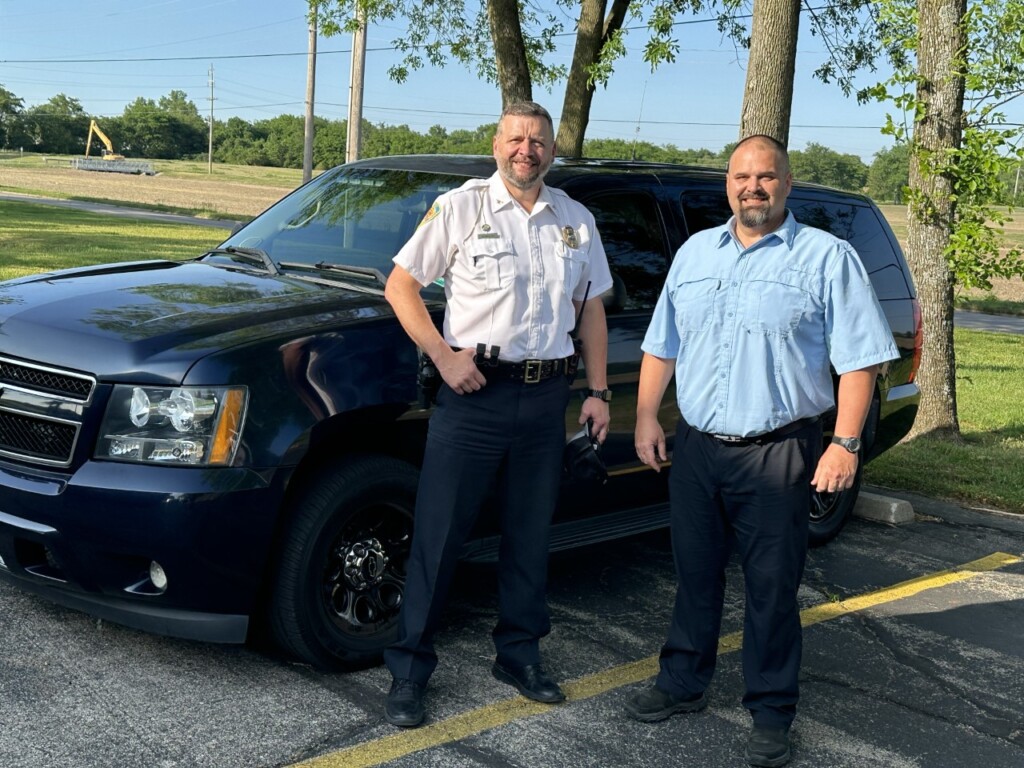 Sikeston DPS Director James McMillen and Sikeston Career and Technology Director Chad King pose in front of the Chevy Tahoe that Sikeston DPS donated to the SCTC criminal justice program. (Source: City of Sikeston)