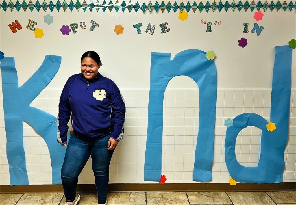A female middle school student smiles for a Kindness Day photo. (Source: Union City Schools)