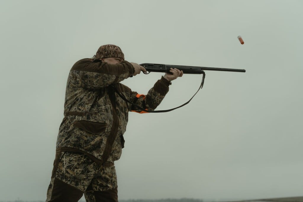 person firing a gun hunting (Source: Pexels/Tima Miroshnichenko)