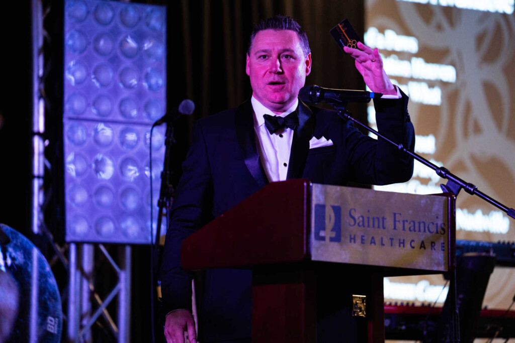 Stacy Huff, Executive Director of Saint Francis Foundation, announces the winner of an auction item. (Source: Saint Francis Healthcare System)