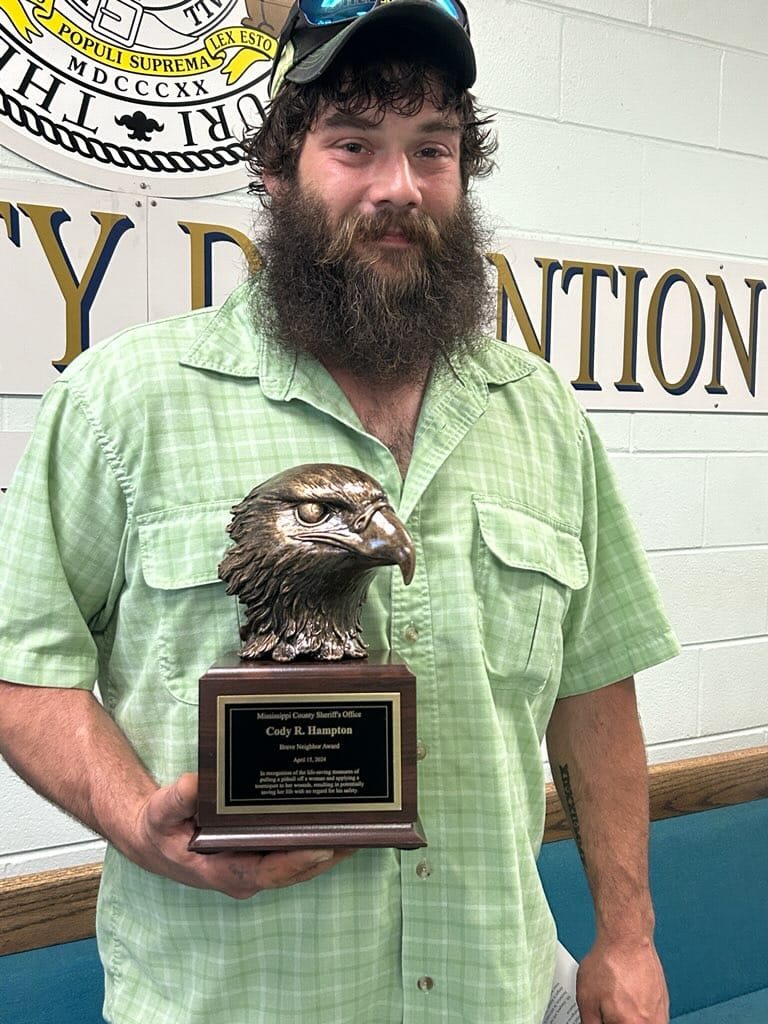 Cody Hampton received the Brave Neighbor Award for helping save a woman's life when she was attacked by a dog. (Source: Britton Ferrell/Facebook)