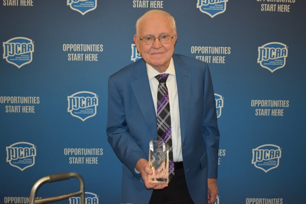 Three Rivers College’s Gene Bess holds his monument after being inducted into the NJCAA Foundation Hall of Fame on June 6 during a ceremony in Charlotte, N.C. (Source: NJCAA Hall of Fame)