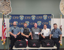 Pictured L-R, Officer Garden, Officer Stewart, Dr. Troop, Chief Reno & Officer Moorman (Source: Carbondale Police Department)