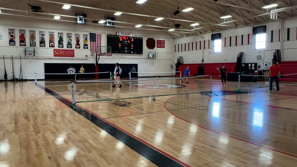 Students playing pickleball.