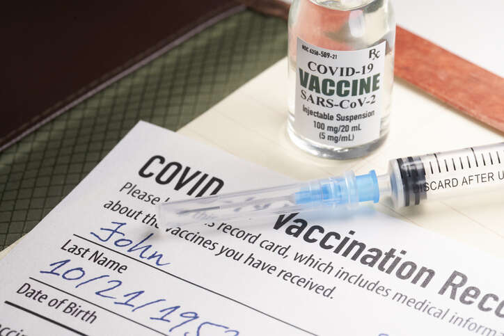 Covid 19 Vaccination Record Card With Syringe And Vial