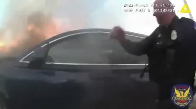 Phoenix Police Officer Rescues A Man From A Burning Vehicle