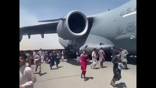 People In Afghanistan Attempt To Flee By Holding Onto Military Plane
