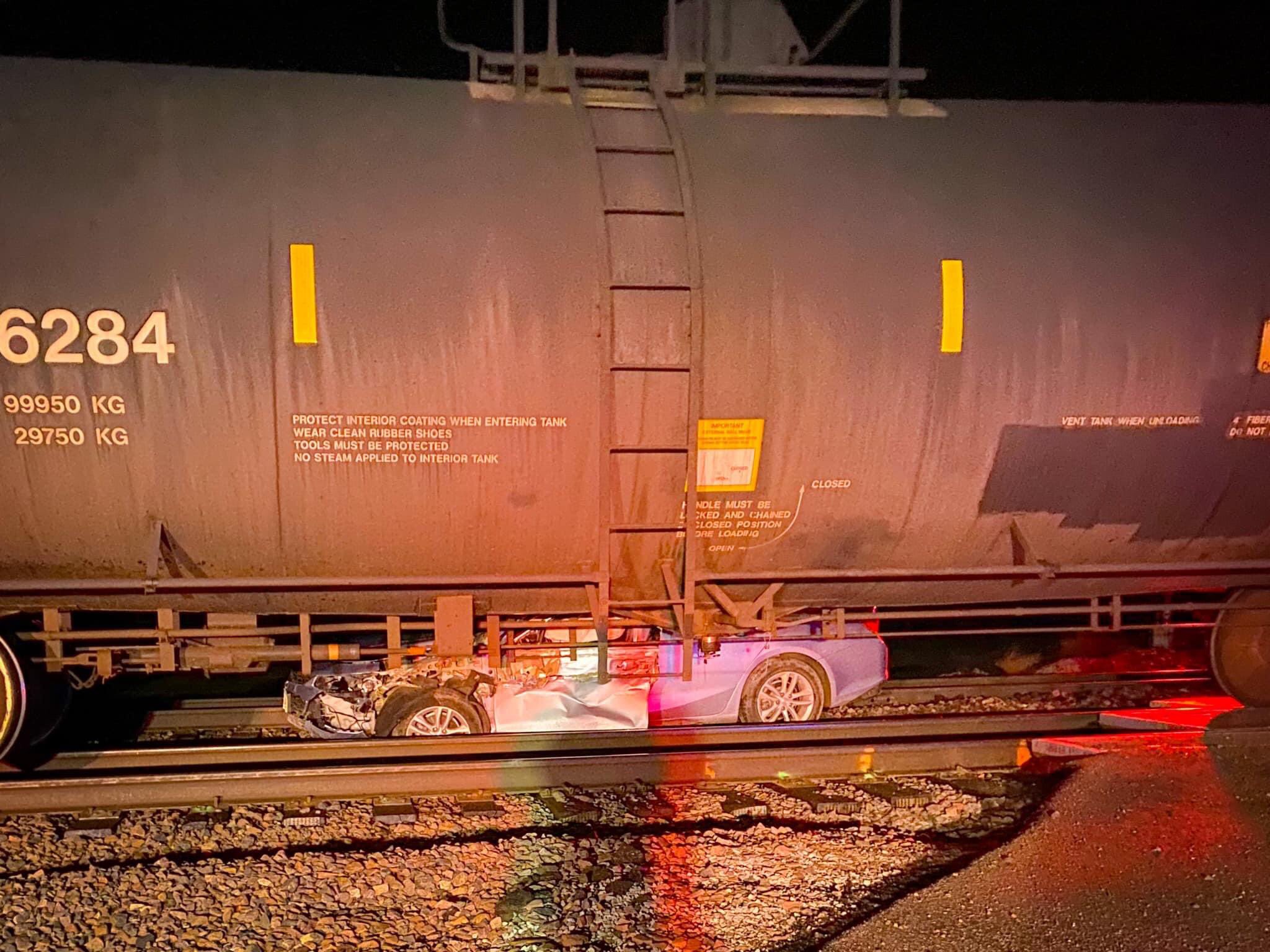 Two people hospitalized after car, train crash