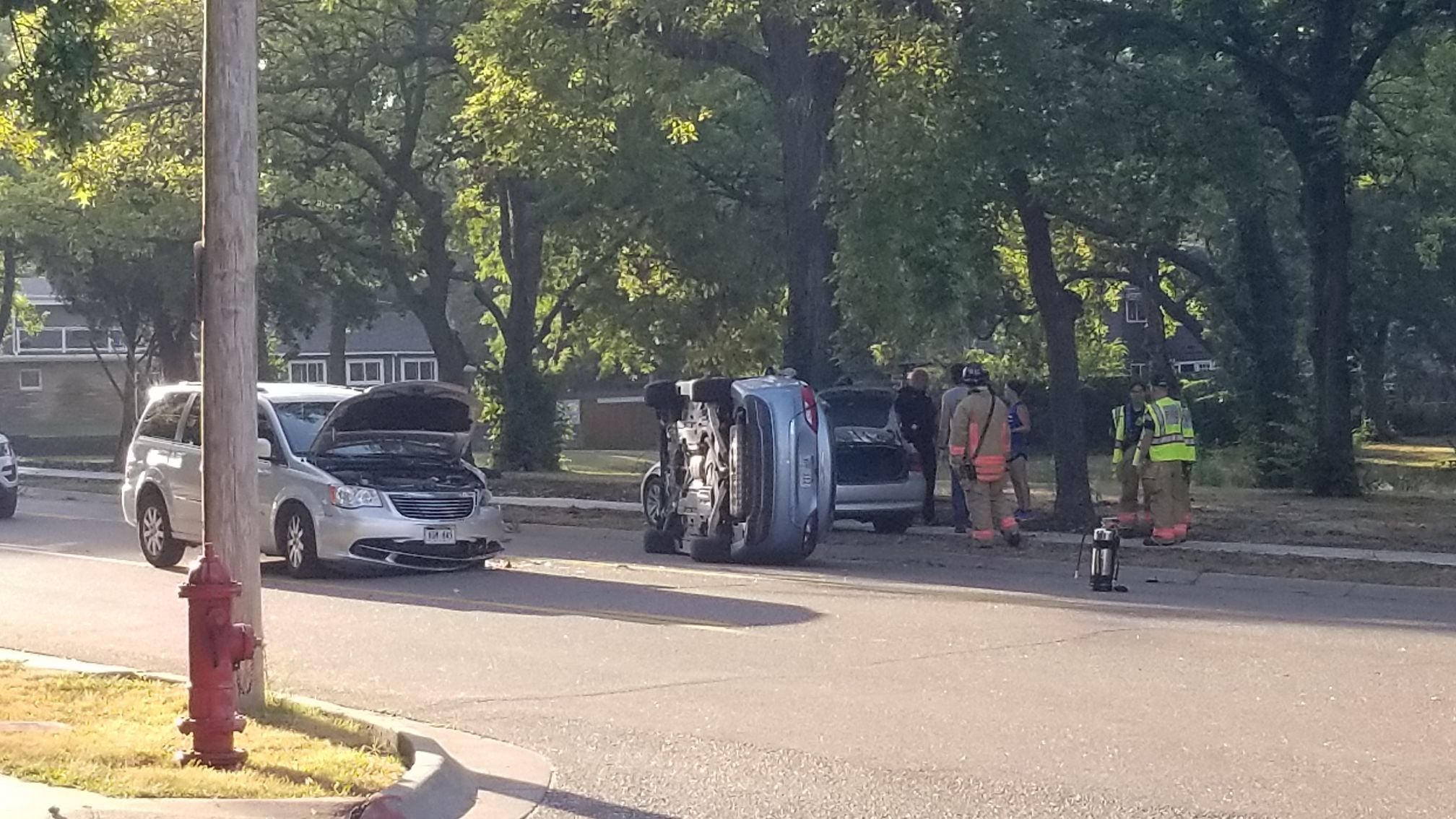 Car hurls onto its side after colliding with minivan near Lincoln school