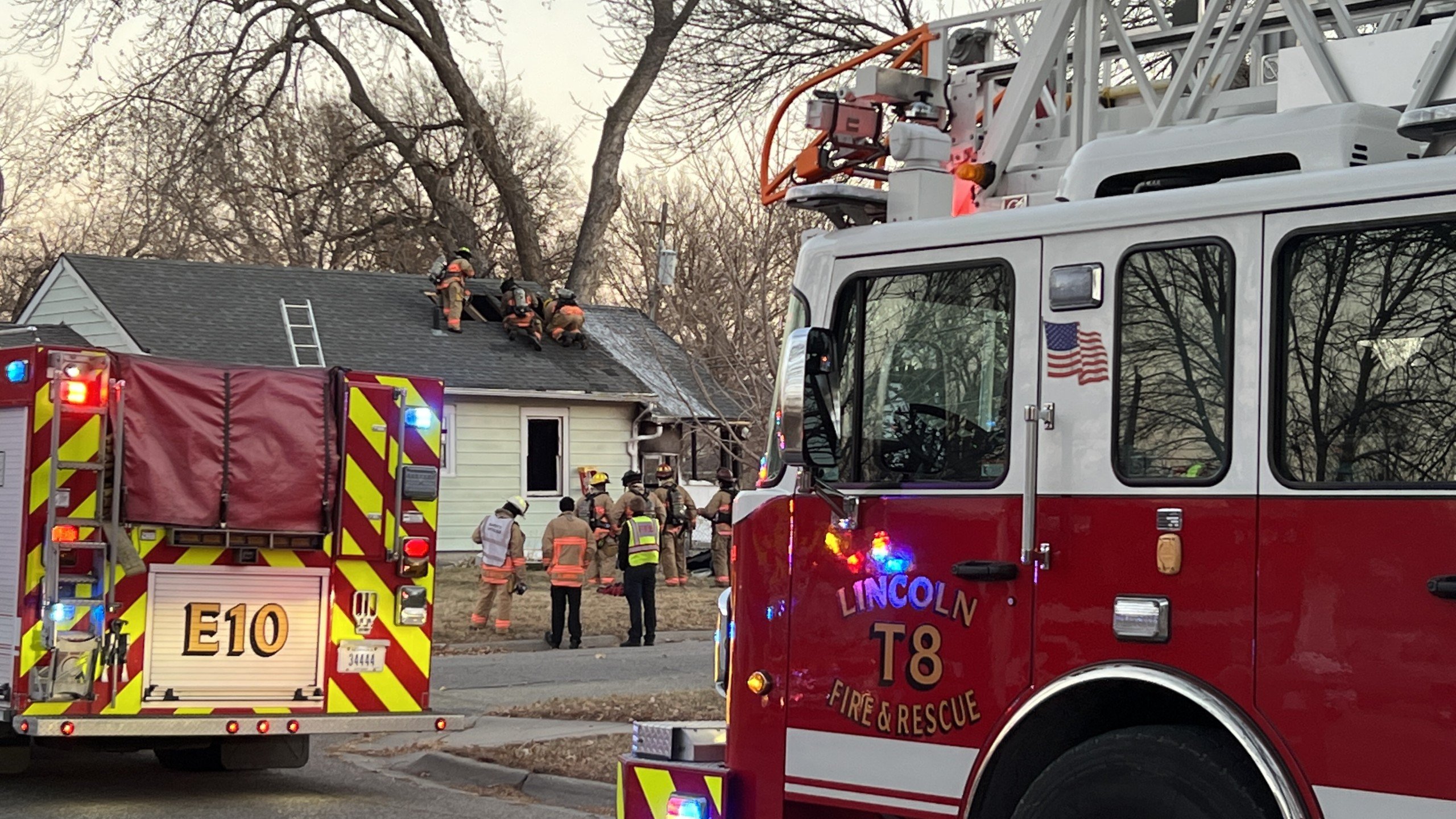 Fire crews battle flames in strong winds at Lincoln home