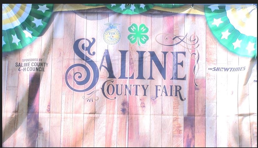 Banner with Saline County Fair written on it.