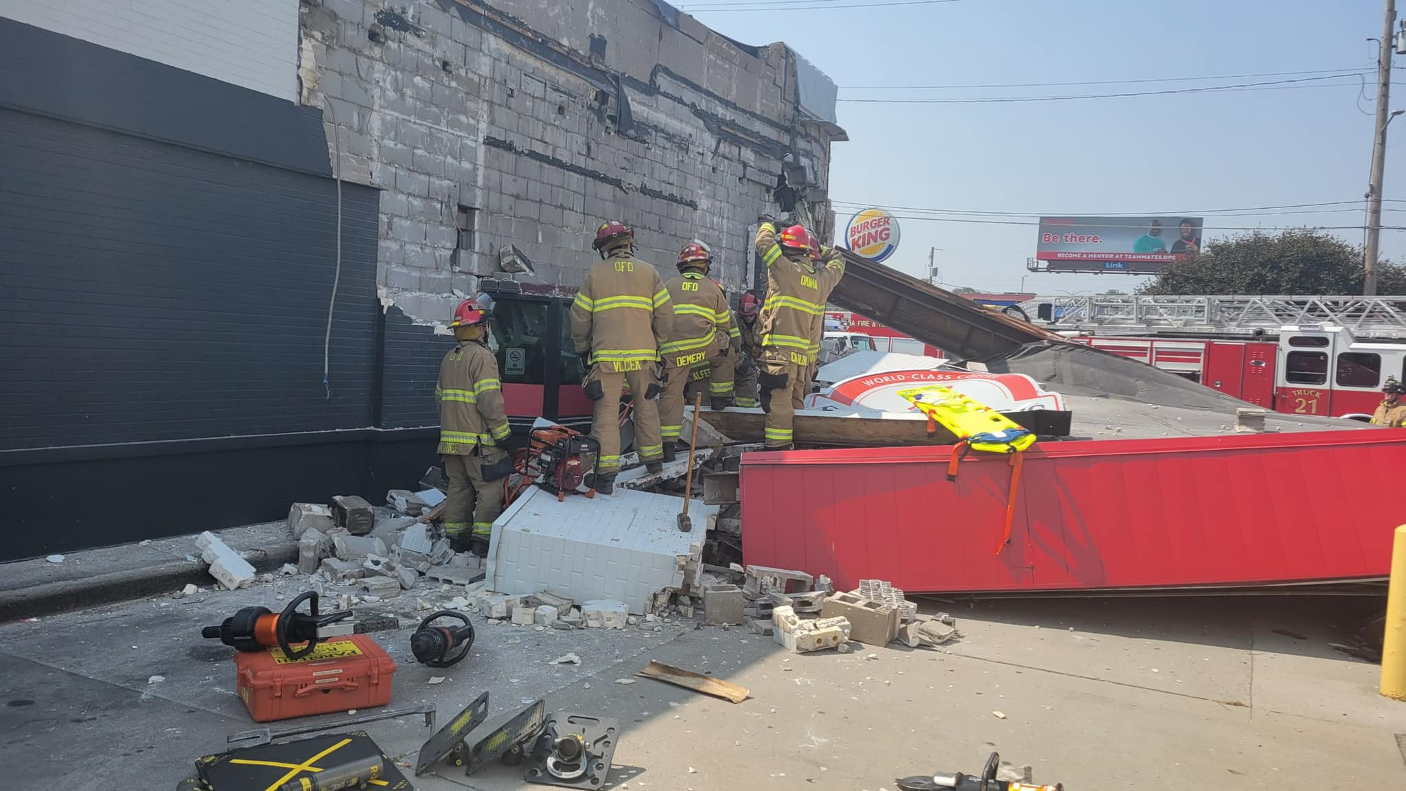 One trapped after part of Omaha Scooter's building collapses