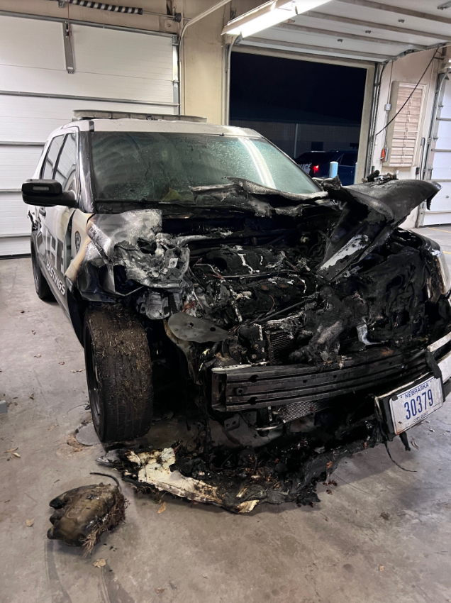 Skid loader causes damage to several police cruisers