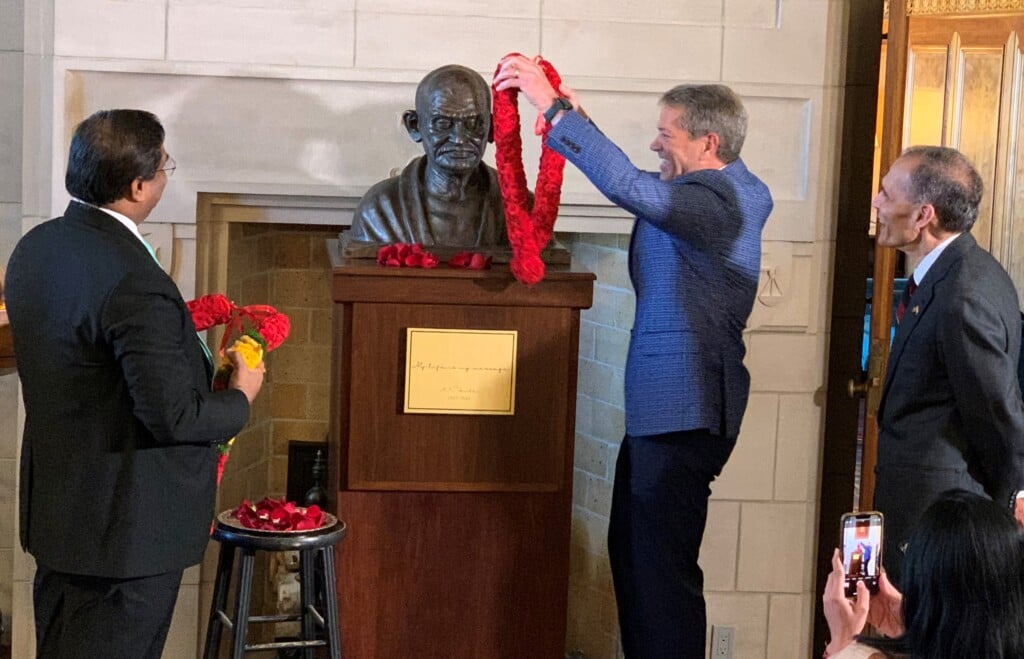 Gov. Jim Pillen with the bust of Mahatma Gandhi in the Nebraska State Capitol.