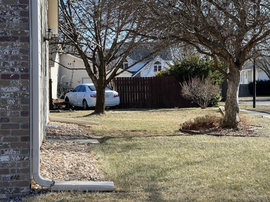 Two-vehicle accident in north Lincoln sends one car through fence