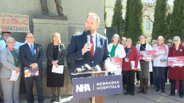 Jeremy Nordquist, president of the Nebraska Hospital Association, speaks outside the state Capitol.
