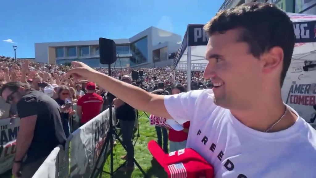 Charlie Kirk throws a hat to someone in the crowd at an event at Utah Valley University before he was fatally shot on Wednesday.