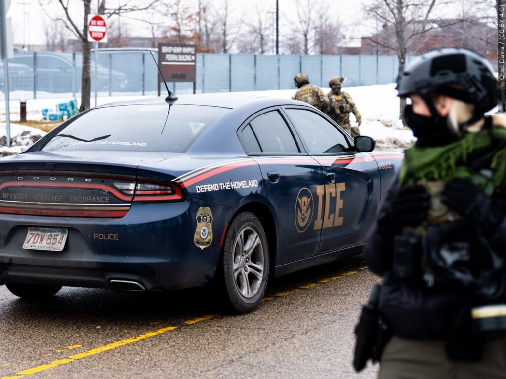 ICE officer and car