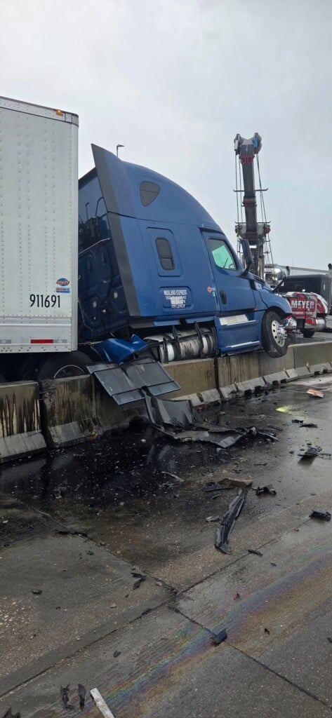 Semi on top of barrier in I-80