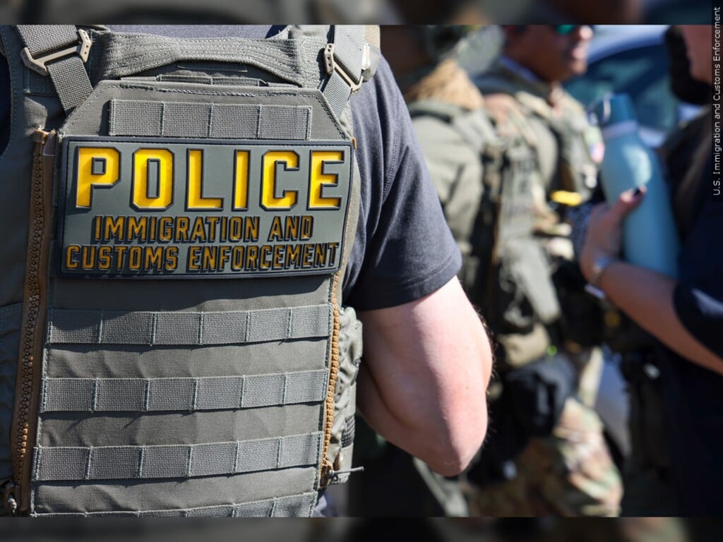 ICE agent vest with police on the back.