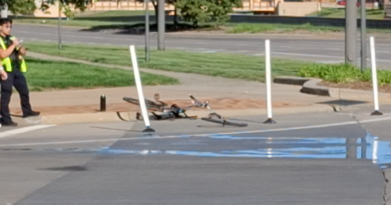Bike laying on the road after being hit.