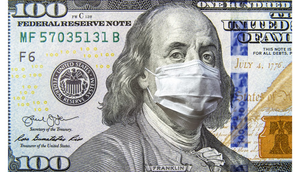 Covid 19 Coronavirus In Usa, 100 Dollar Money Bill With Face Mask. Coronavirus Affects Global Stock Market.