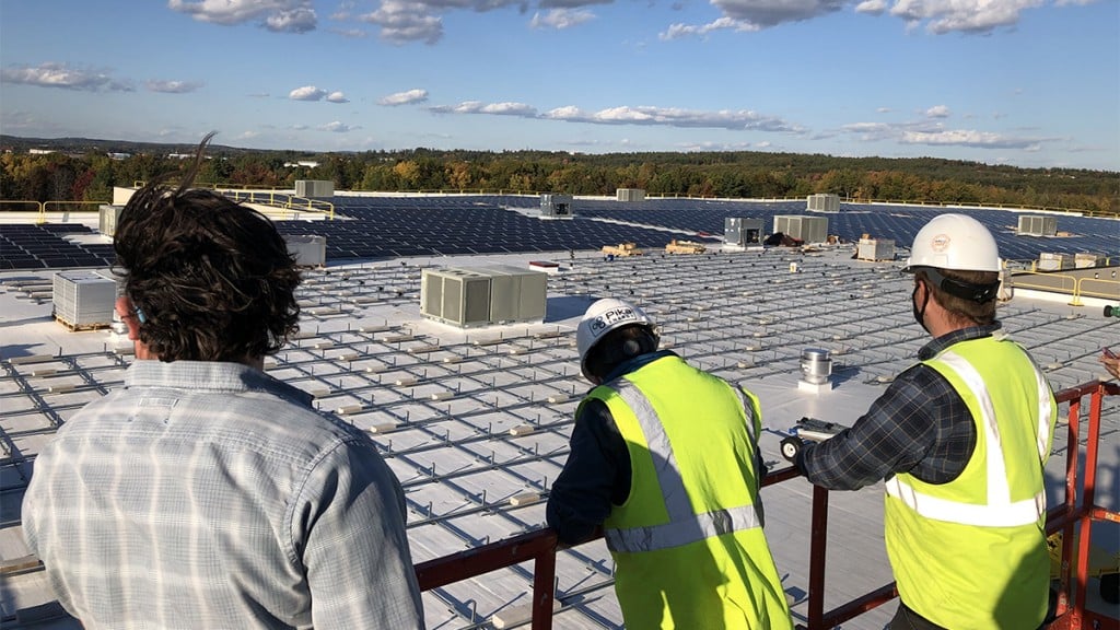 Bellavance Beverage Workers Look Out Over Solar Array1200