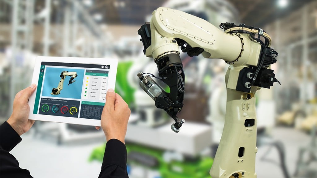 Iot Industry 4.0 Concept,industrial Engineer Using Software (augmented, Virtual Reality) In Tablet To Monitoring Machine In Real Time.smart Factory Use Automation Robot Arm In Automotive Manufacturing