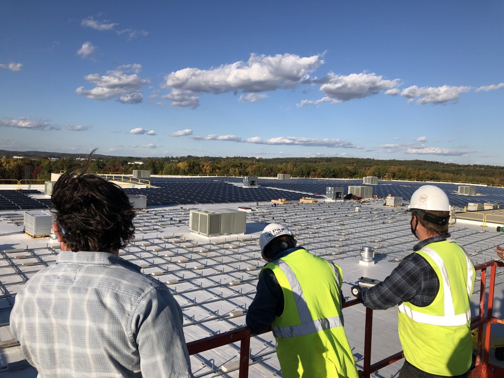 Bellavance Beverage Workers Look Out Over Solar Array