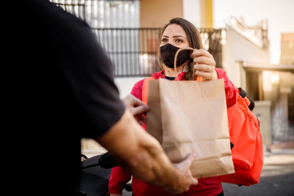 Woman With Mask Delivering Fastfood Motogirl