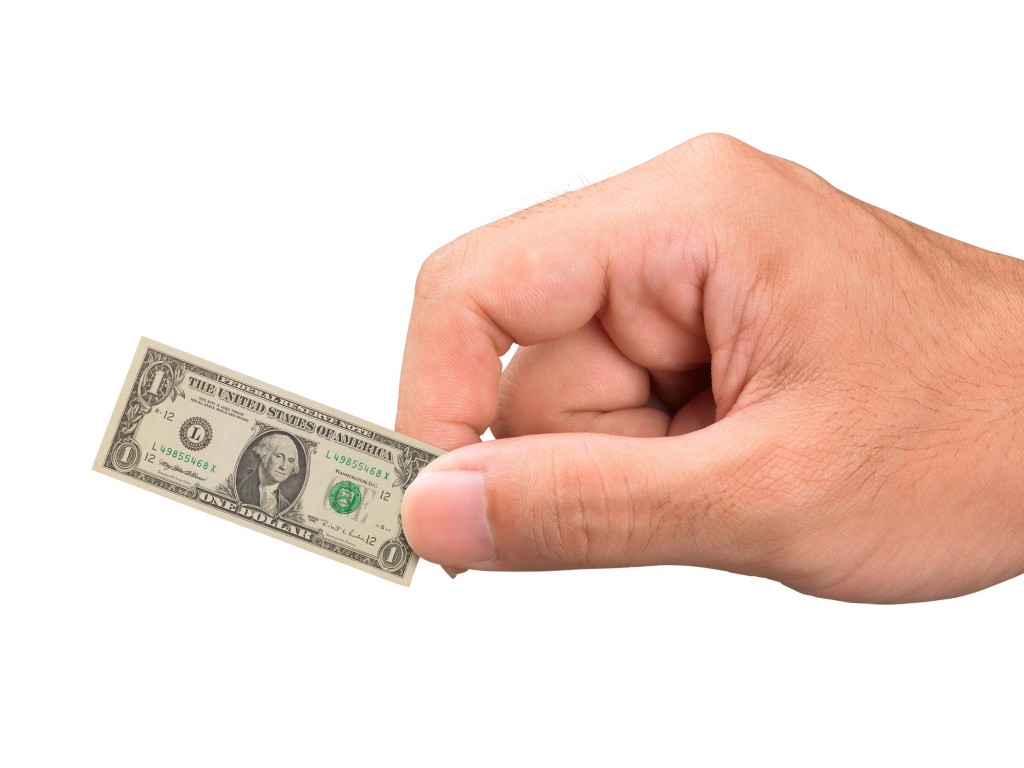 Hand Holding Miniature Dollar