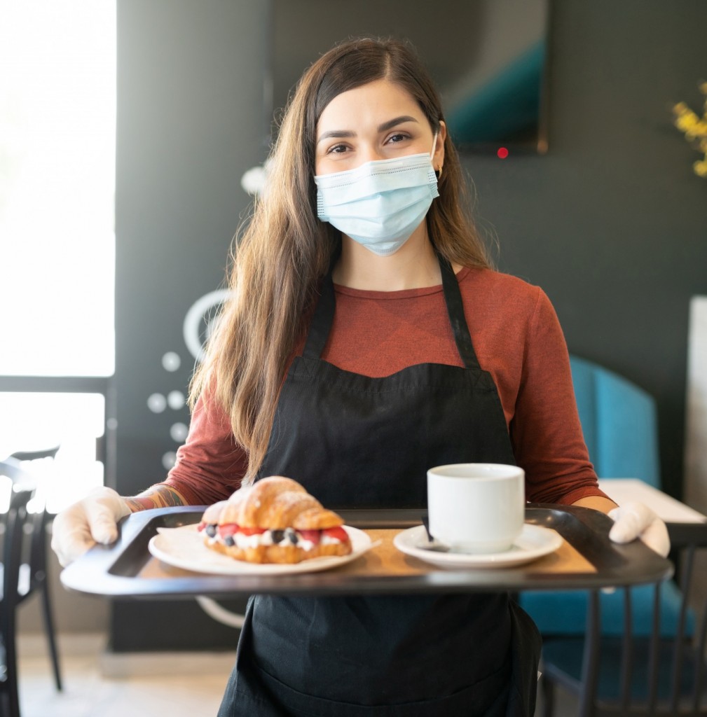 Female Server With Order In Tray At Cafe