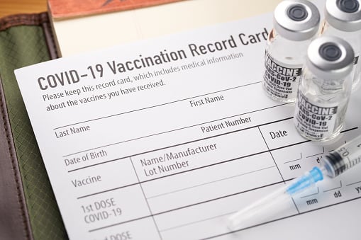 Covid 19 Vaccination Record Card With Vials And Syringe.