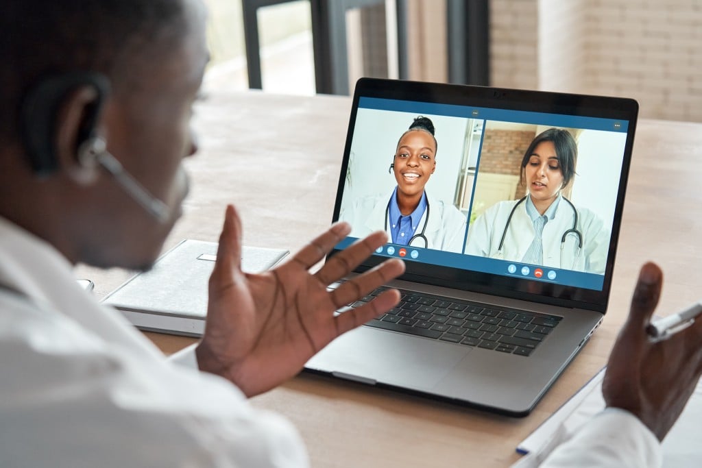 Multicultural Doctors Team Conferencing In Video Call Chat Discussing Health Care Learning Online During Web Seminar. Group Medical Webinar Training, Healthcare Elearning Videoconference Concept.