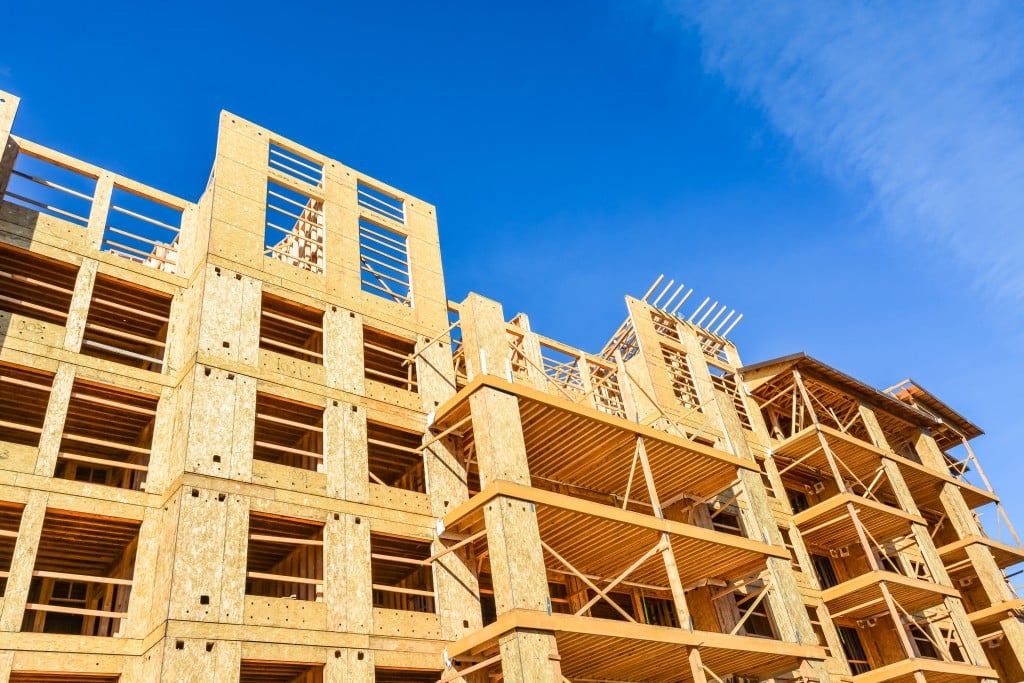 New Low Rise Building Under Construction On Blue Sky Background