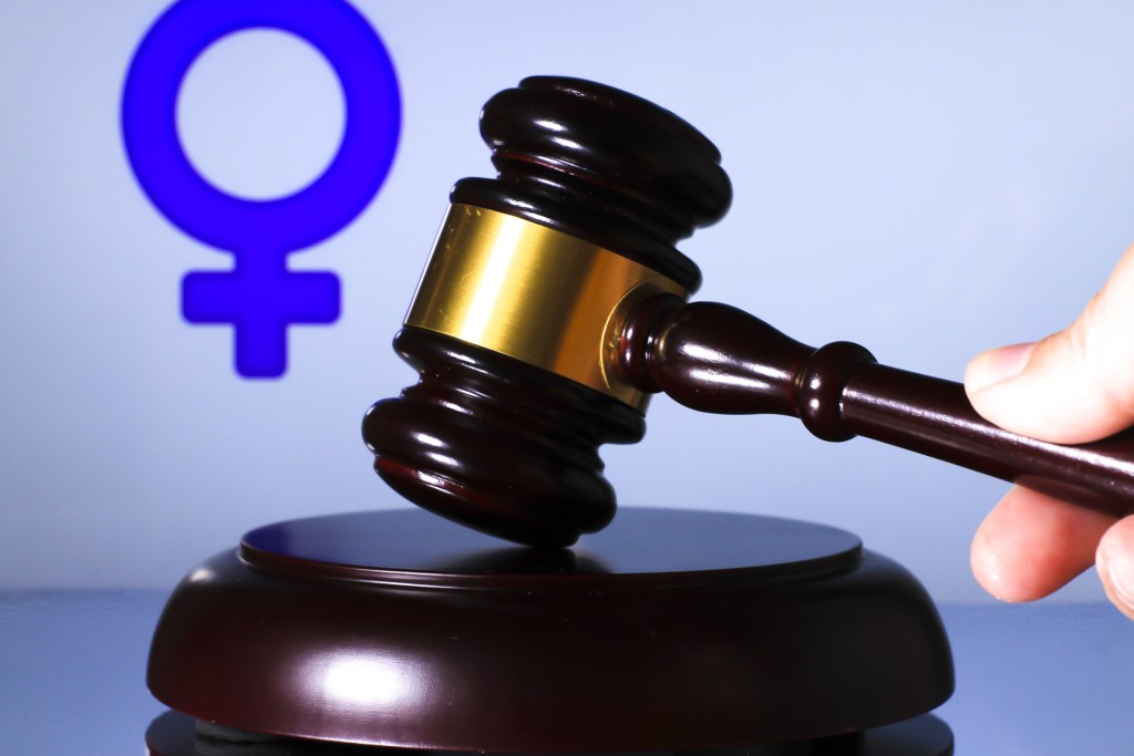 Judge Mallet And Gender Symbol On White Background