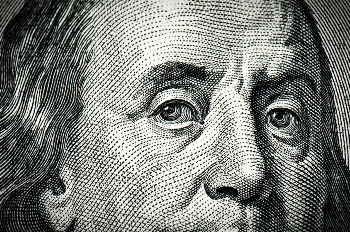 closeup of ben franklin's eyes on currency