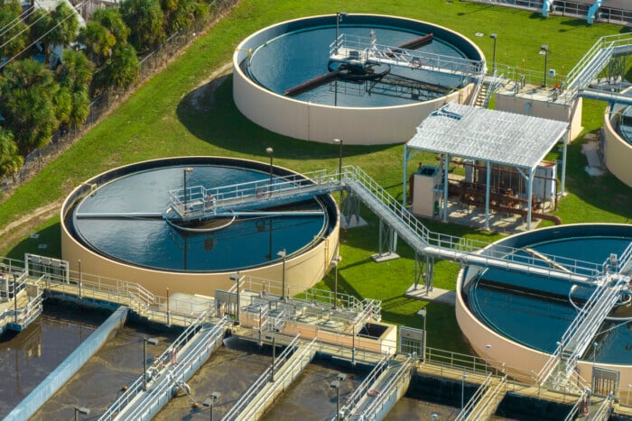 Aerial View Of Modern Water Cleaning Facility At Urban Wastewater Treatment Plant. Purification Process Of Removing Undesirable Chemicals, Suspended Solids And Gases From Contaminated Liquid
