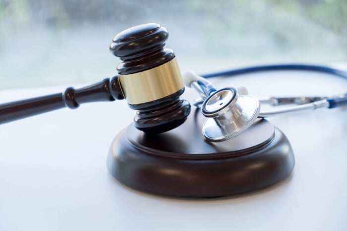 Gavel And Stethoscope. Medical Jurisprudence. Legal Definition Of Medical Malpractice. Attorney. Common Errors Doctors, Nurses And Hospitals Make