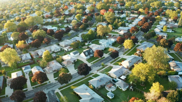 Aerial View Of Residential Houses At Autumn (october). American Neighborhood, Suburb. Real Estate, Drone Shots, Sunset, Sunny Morning, Sunlight, From Above