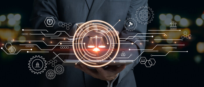 Businessman Touching The Icon Of The Balance Of Justice. Concept Of Legal Advice, Law And Defense.