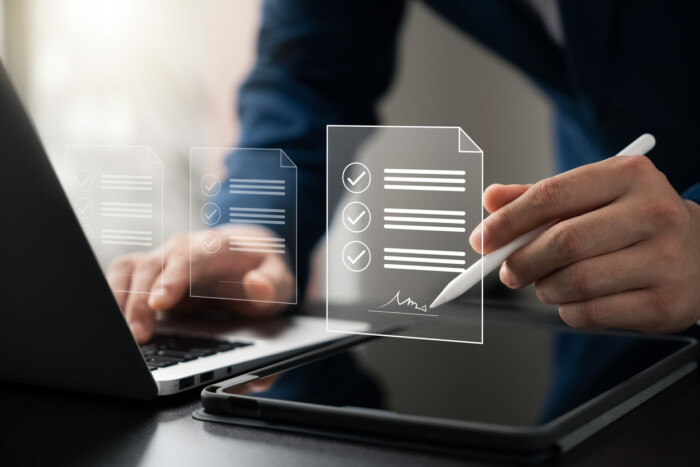 Electronic Signature Concept, Electronic Signing Businessman Signs Electronic Documents On Digital Documents On Virtual Laptop Screen Using Stylus Pen.