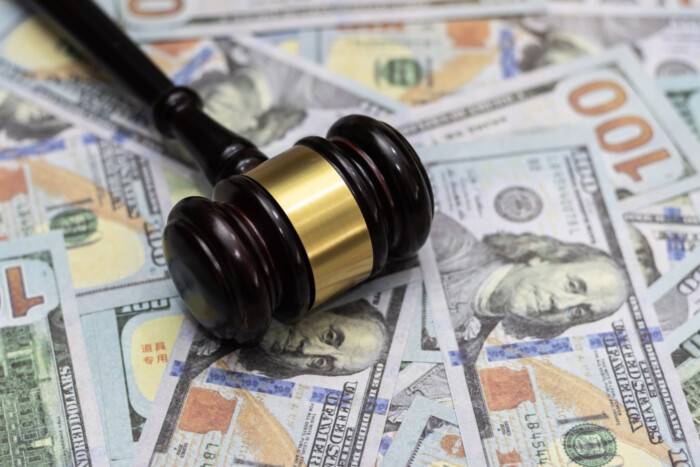 Money And Hammer,wooden Gavel And Dollar Banknotes