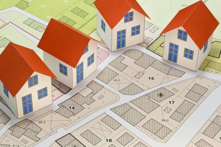 New Home And Free Vacant Land For Building Activity Construction Industry And Building Permit Concept With A Residential Area, Cadastral Map, General Urban Planning And Zoning Regulations