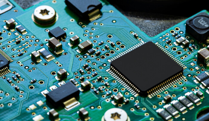 Macro Close Up Of Components And Microchips On Pc Circuit Board