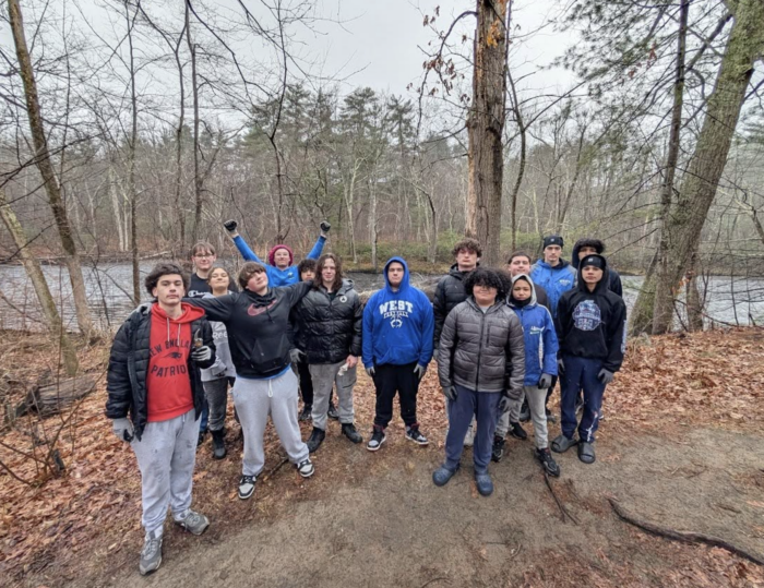 15 West High Football Players Volunteering At Piscataquog Park