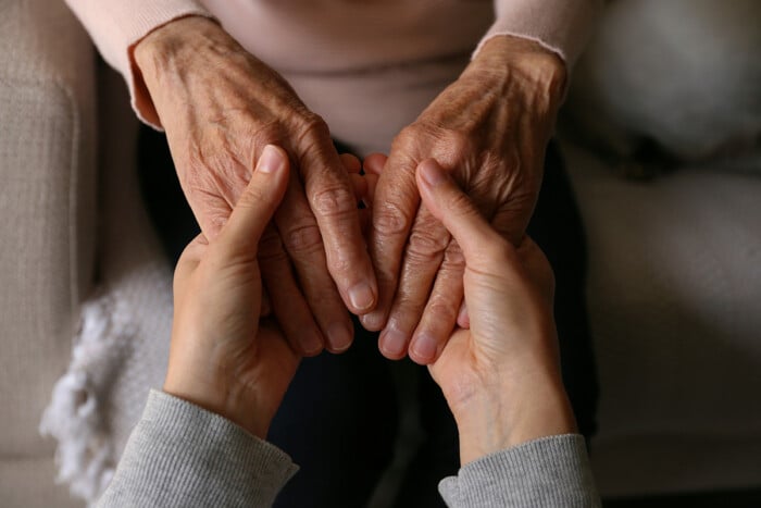 Cropped Shot Of Elderly Woman And Female Geriatric Social Worker