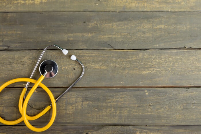 Stethoscope On Wooden Table Top View, Flat Lay Healthcare Background, Space For Text