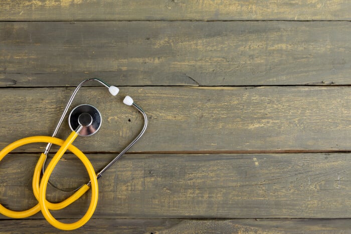 Stethoscope On Wooden Table Top View, Flat Lay Healthcare Background, Space For Text