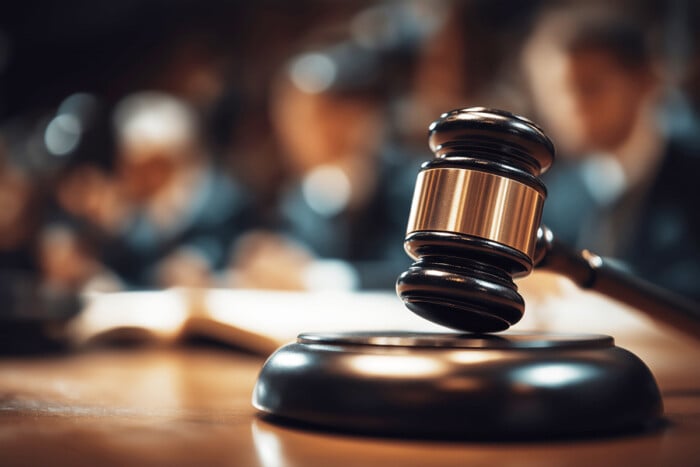 Wooden Judicial Hammer On Table Close Up. Law And Justice. The Courtroom